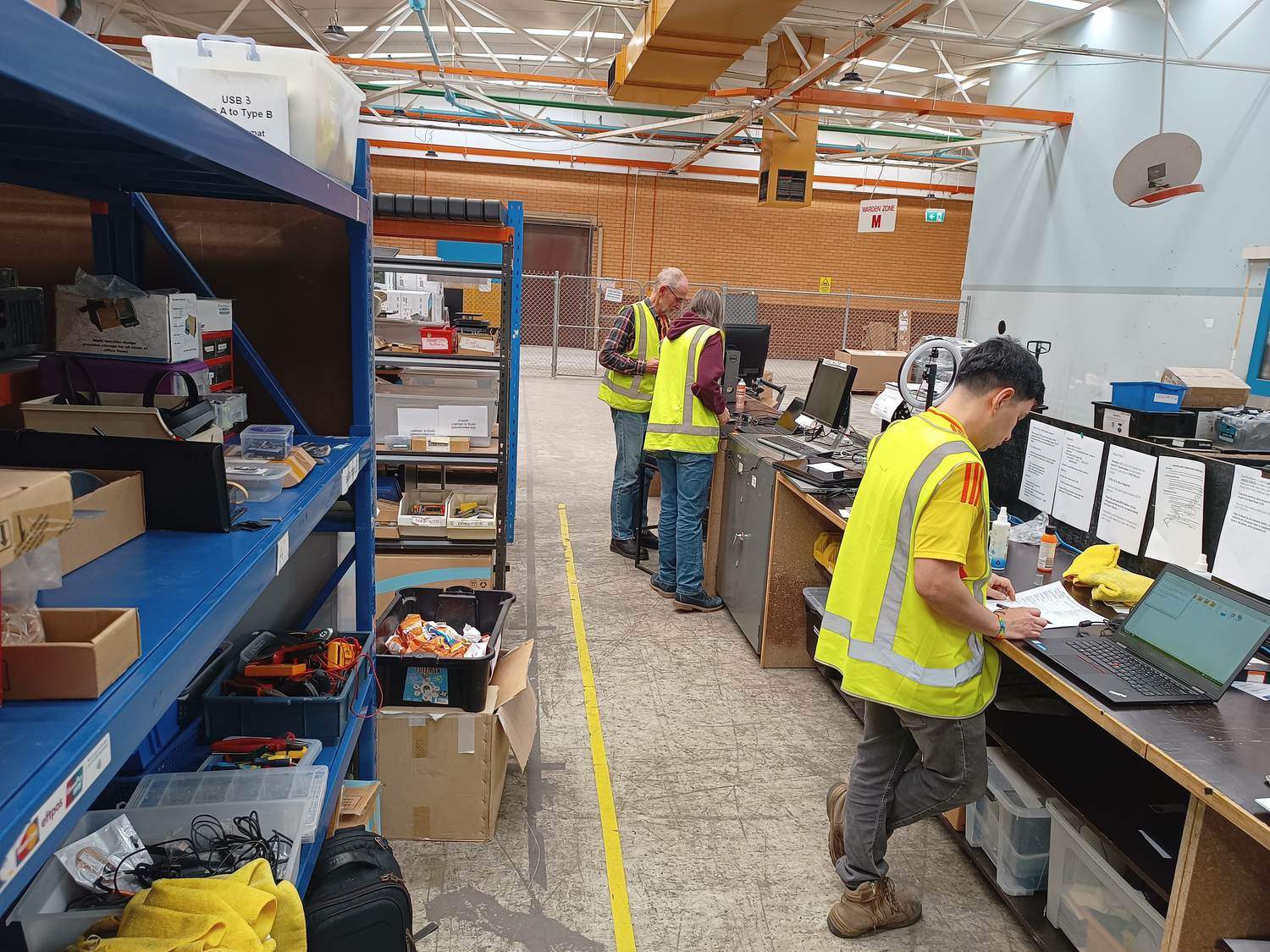 Parts shelving and workbenches in the build room