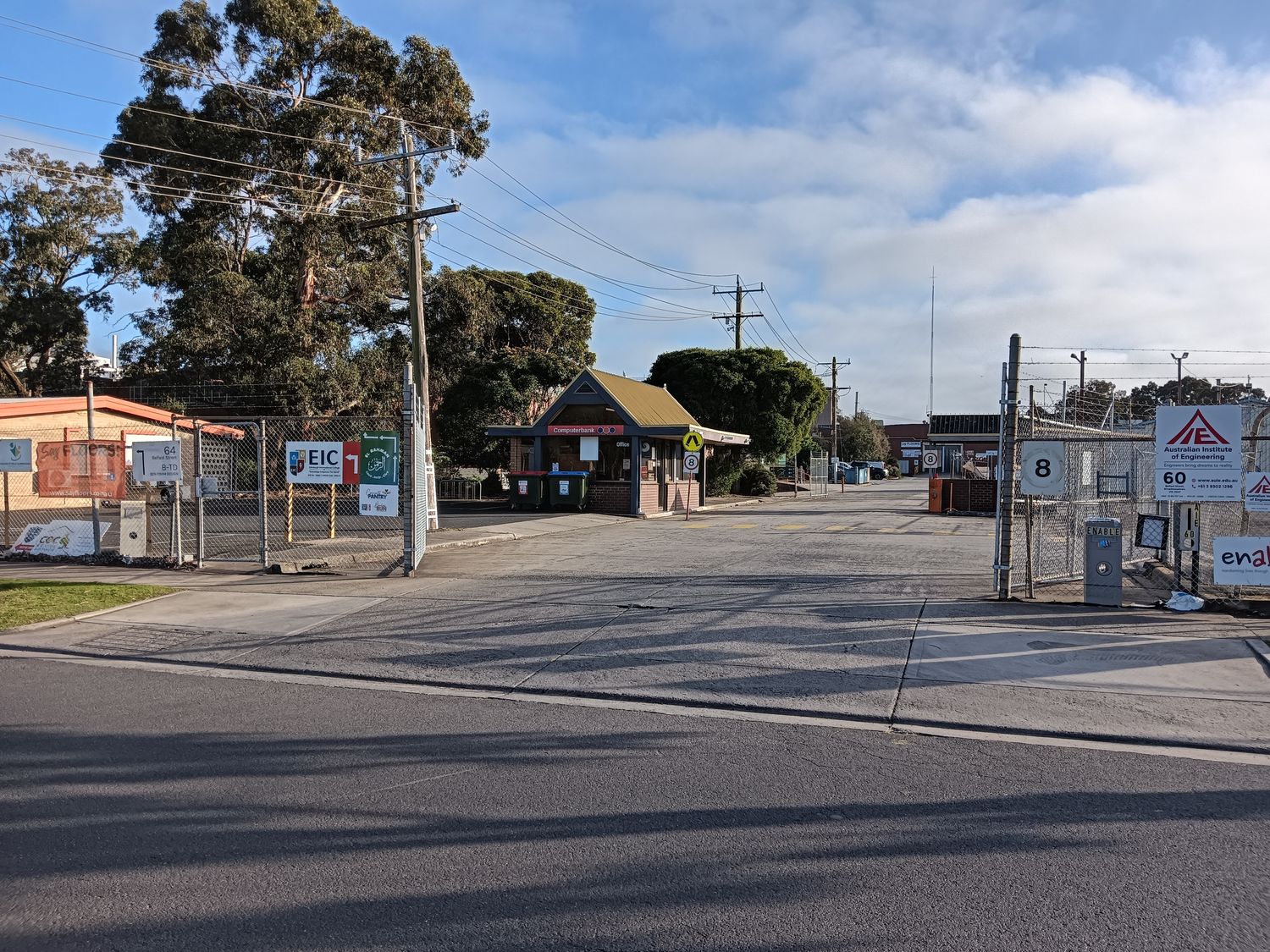 The driveway into 60 Belfast Street. Our office is the small building with the Computerbank sign, straight ahead.