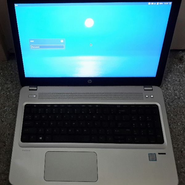 Refurbished HP ProBook laptop at the Linux Mint login screen