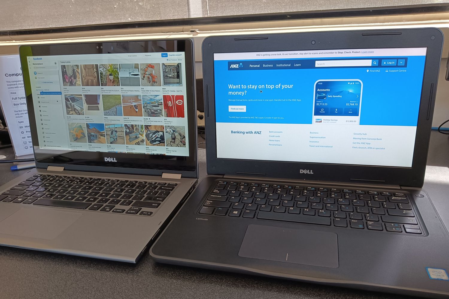 Two demo Dell laptops in our showroom showing Facebook Marketplace and the ANZ website
